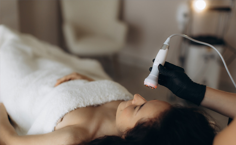 Woman receiving treatment at a Grand Lake Region med spa